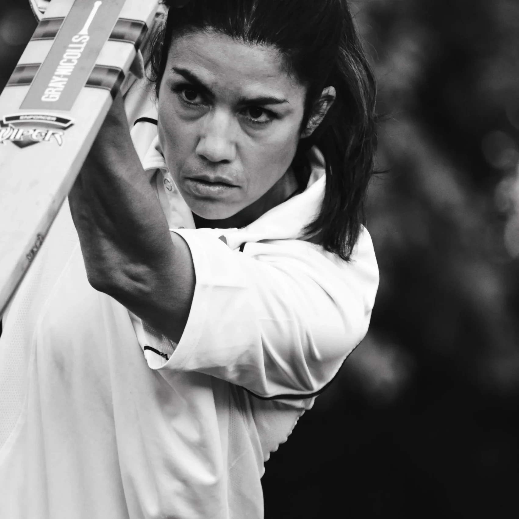 Woman holding a cricket bat during play