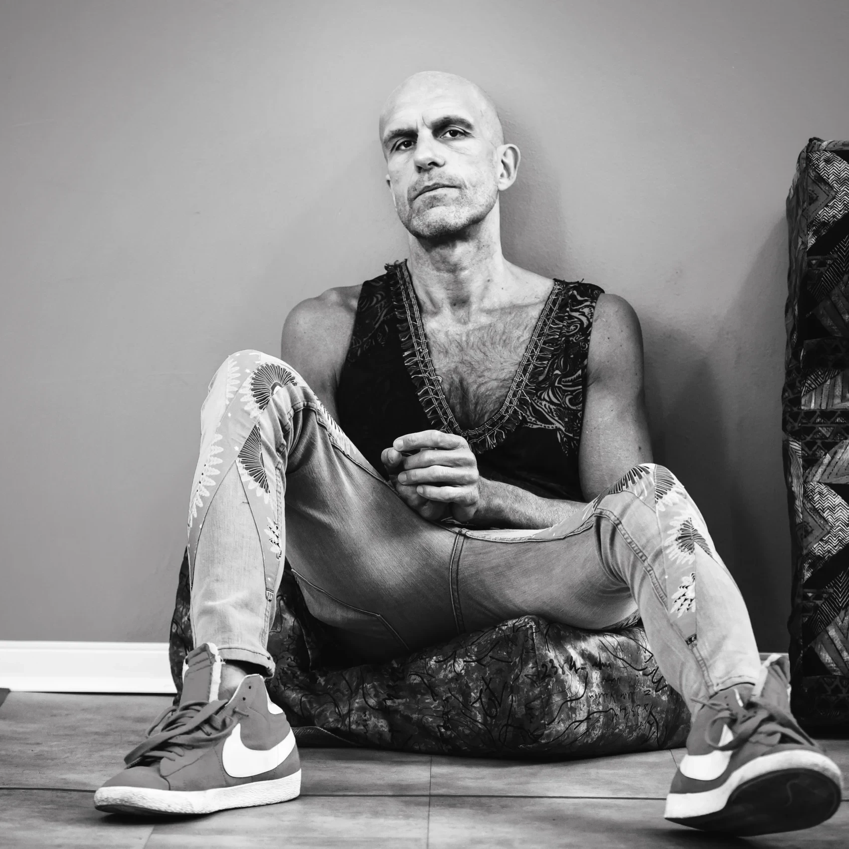 Athlete sitting on the floor and resting after training